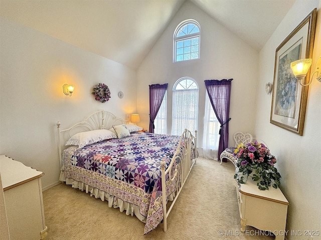 bedroom with light carpet and high vaulted ceiling