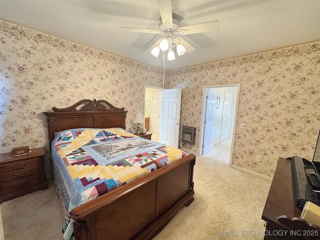 bedroom with baseboards, light colored carpet, wallpapered walls, and ceiling fan