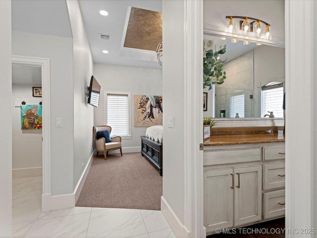 ensuite bathroom with a shower with shower door, visible vents, recessed lighting, connected bathroom, and vanity