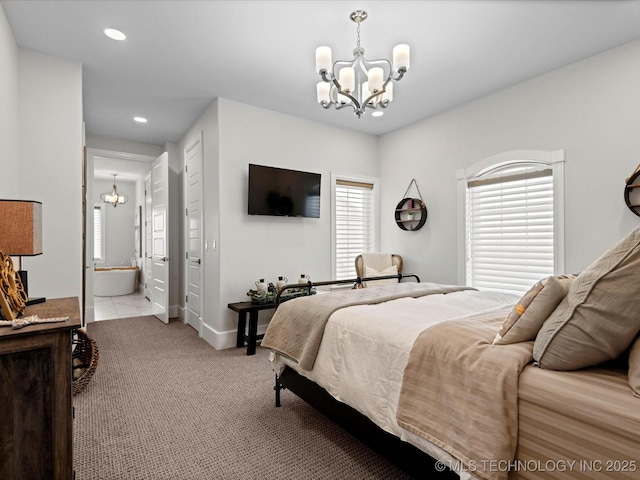 bedroom with light carpet, recessed lighting, connected bathroom, and an inviting chandelier