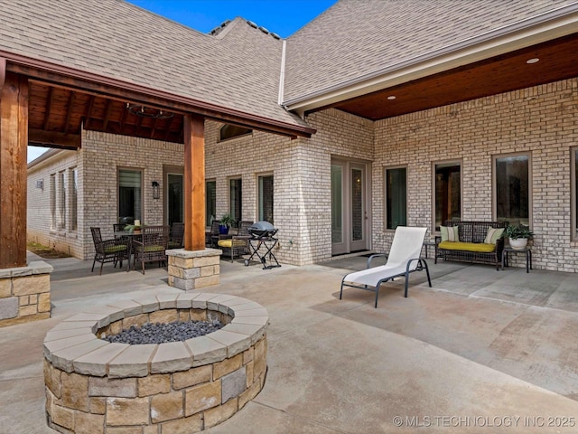 view of patio with a fire pit