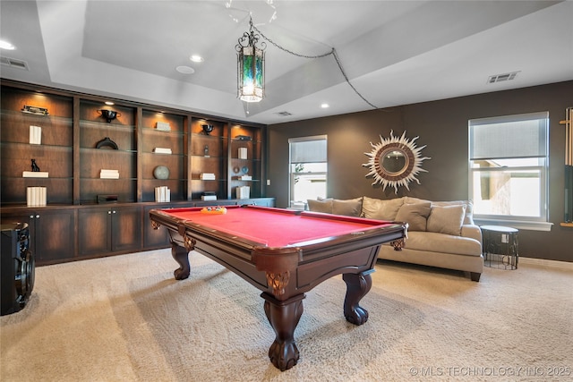 game room with light carpet, visible vents, and a raised ceiling