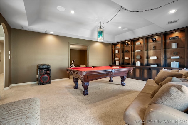 playroom featuring visible vents, a tray ceiling, carpet floors, recessed lighting, and arched walkways