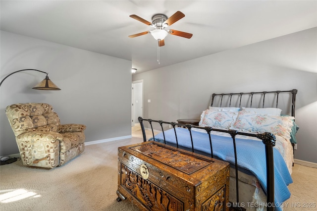 bedroom featuring baseboards, ceiling fan, and carpet flooring