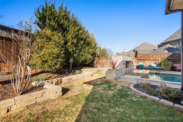 view of yard featuring a fenced in pool and a fenced backyard