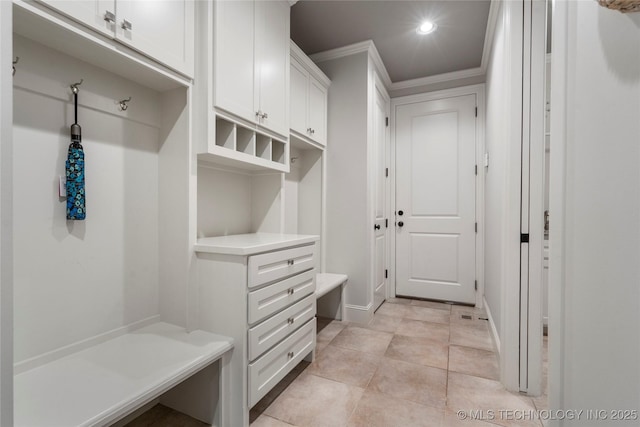 mudroom featuring light tile patterned floors, ornamental molding, and recessed lighting