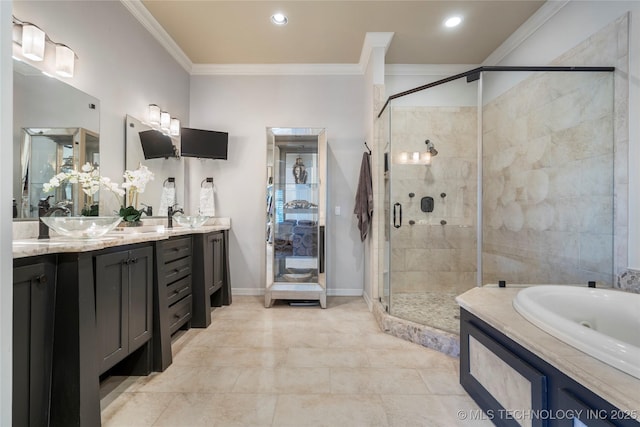 full bath with a stall shower, baseboards, ornamental molding, and vanity