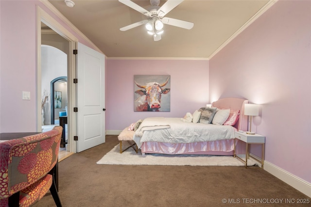 bedroom featuring crown molding, baseboards, carpet floors, arched walkways, and a ceiling fan