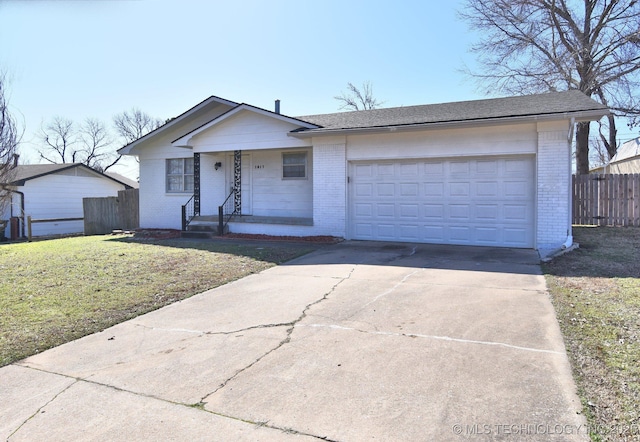 ranch-style home featuring a front yard, fence, driveway, a garage, and brick siding