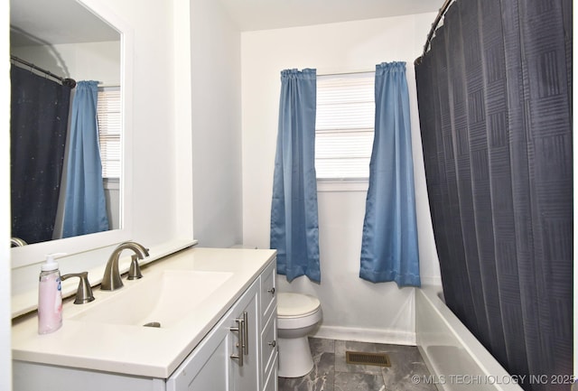 bathroom with vanity, toilet, and visible vents