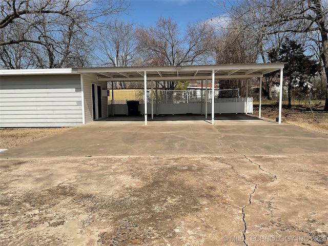 view of car parking featuring concrete driveway