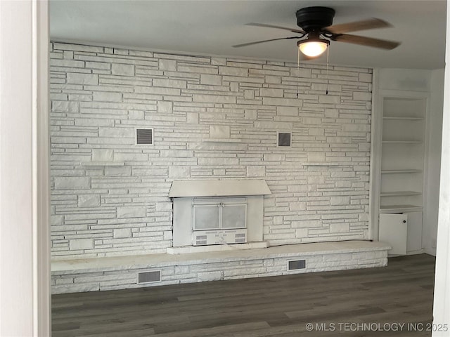 interior details with wood finished floors and ceiling fan