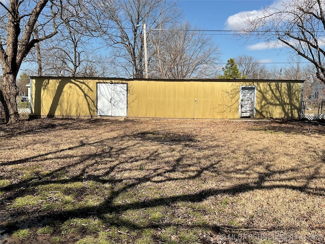 view of yard with an outbuilding and a pole building