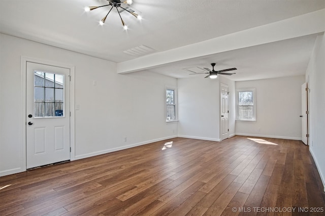 entryway with a wealth of natural light, baseboards, and dark wood-style floors