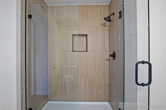 bathroom featuring a shower stall