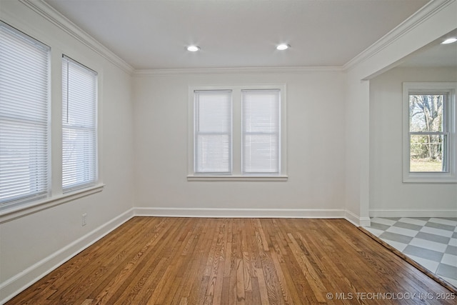 empty room featuring recessed lighting, wood finished floors, baseboards, and ornamental molding