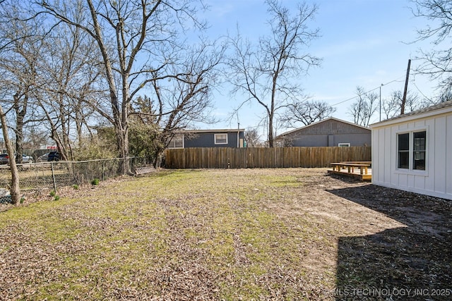 view of yard with a fenced backyard