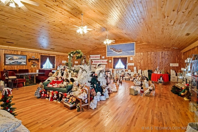 interior space with a wealth of natural light, vaulted ceiling, wood ceiling, and wood finished floors