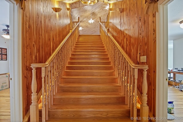 stairs with wood walls