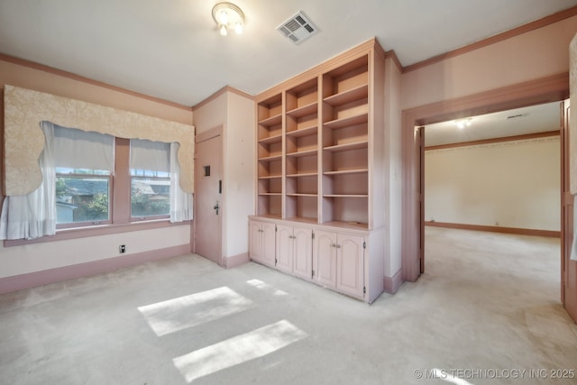 interior space featuring visible vents, light carpet, baseboards, and ornamental molding