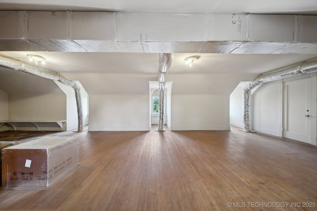 bonus room with light wood finished floors and baseboards