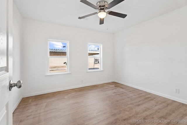 unfurnished room with light wood-style flooring, baseboards, and ceiling fan