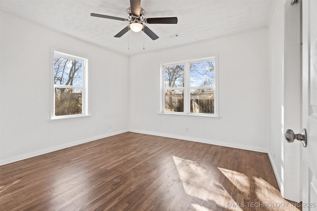 interior space featuring ceiling fan, wood finished floors, visible vents, and baseboards