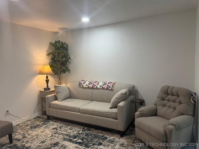 living room featuring baseboards