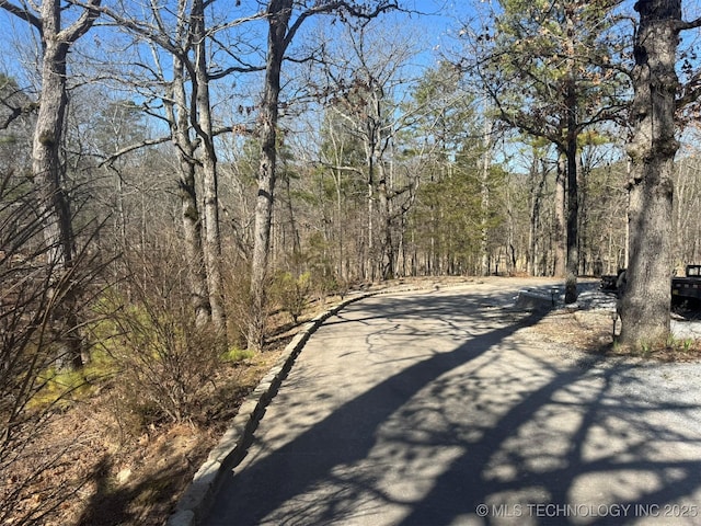 view of road featuring a view of trees