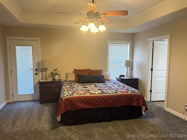 carpeted bedroom featuring a raised ceiling, crown molding, and baseboards