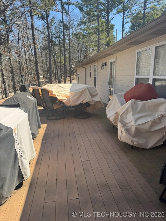 wooden deck with grilling area