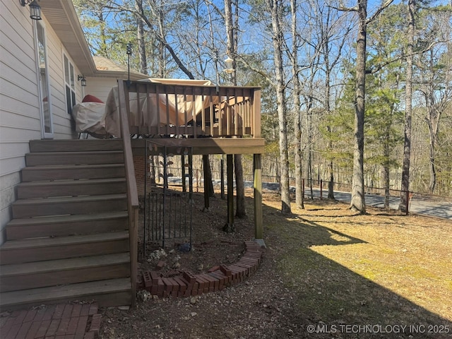 view of yard with a wooden deck and stairs