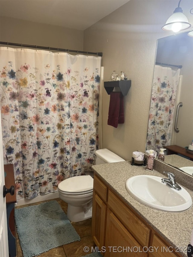 full bath featuring tile patterned floors, lofted ceiling, toilet, and vanity