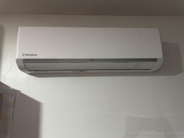 interior details with a wall mounted air conditioner