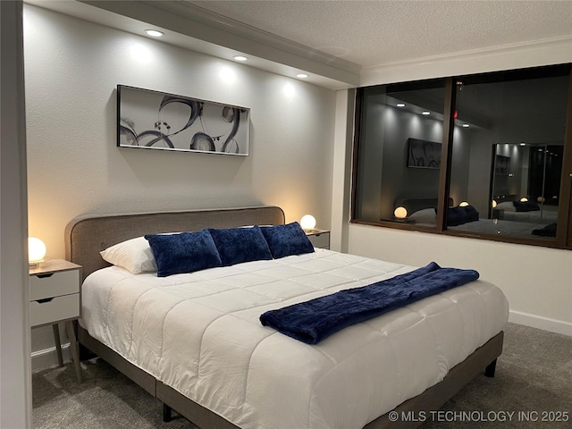 carpeted bedroom with recessed lighting and a textured ceiling