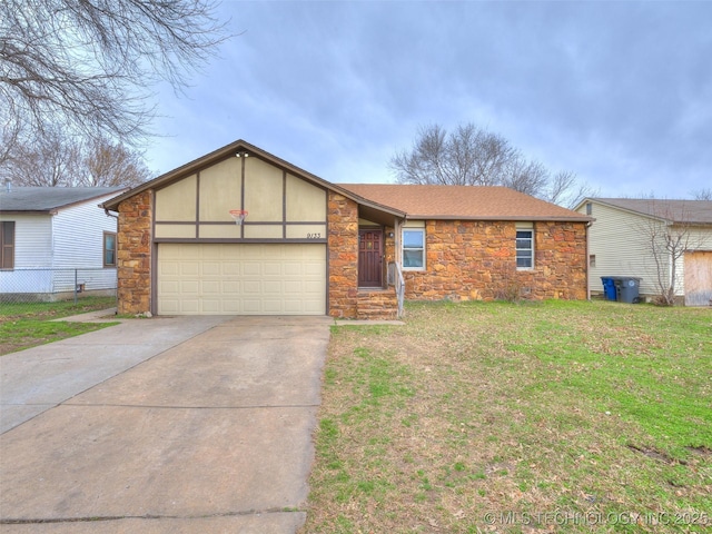 view of front of property with a front yard, driveway, an attached garage, a shingled roof, and stone siding