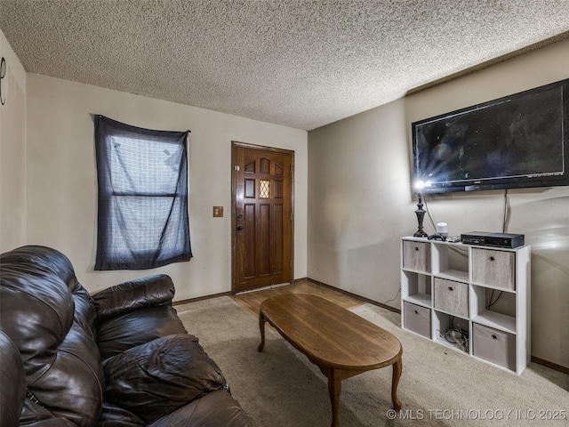 living area with baseboards, carpet floors, and a textured ceiling