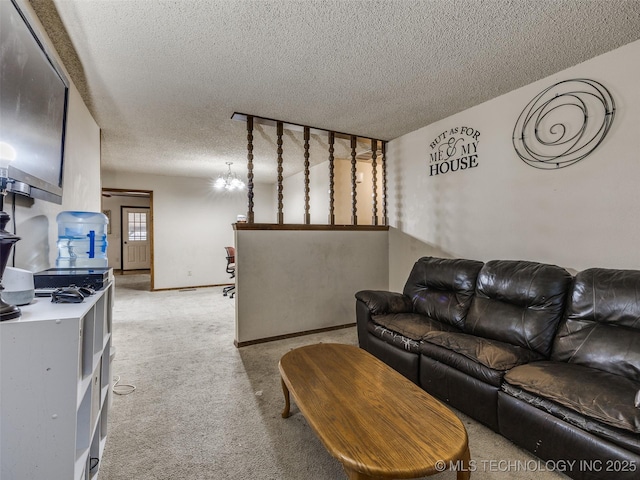 living room with light carpet, a textured ceiling, and baseboards