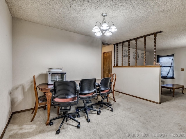 dining space featuring baseboards, a textured ceiling, an inviting chandelier, and carpet flooring