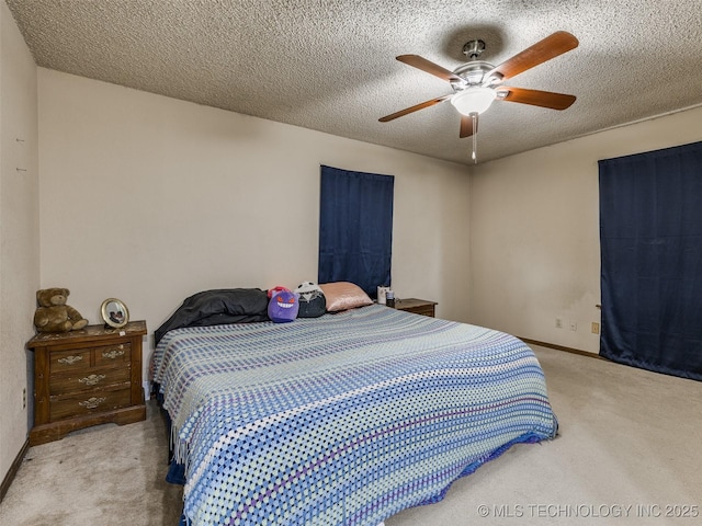 bedroom with baseboards, carpet floors, a textured ceiling, and ceiling fan