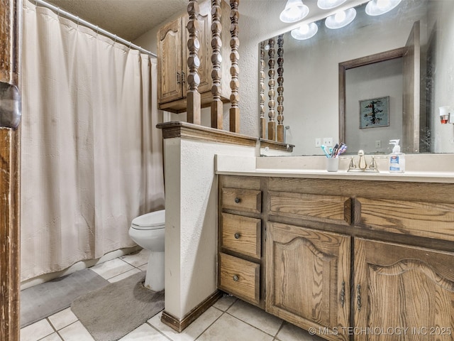 bathroom with tile patterned floors, toilet, a shower with shower curtain, and vanity