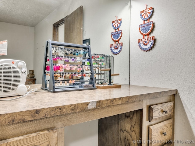 bar with a dry bar, a textured ceiling, and a textured wall