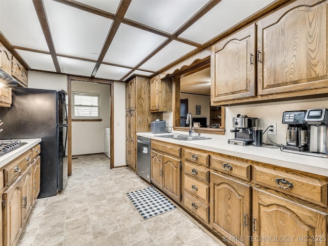 kitchen with a sink, brown cabinets, dishwasher, and light countertops