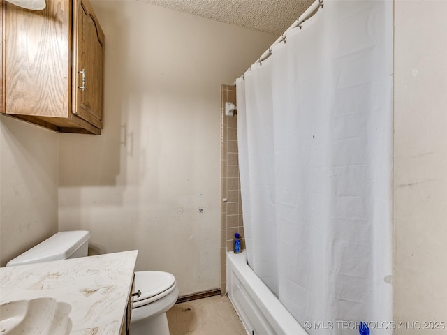 full bath with tile patterned floors, toilet, vanity, and a textured ceiling