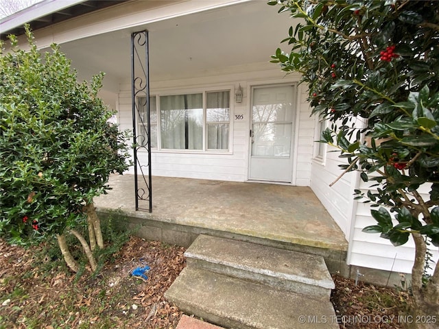 doorway to property with a porch