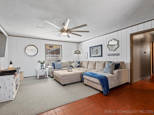 living room featuring a textured ceiling and ceiling fan