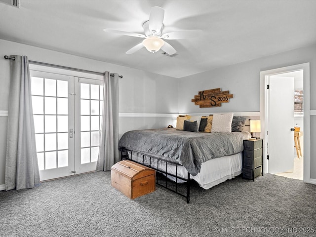 carpeted bedroom featuring french doors, visible vents, and a ceiling fan