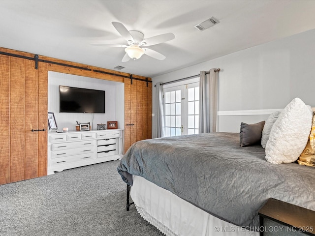 bedroom with visible vents, ceiling fan, and carpet