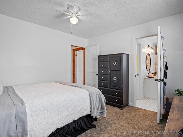 bedroom featuring ceiling fan, carpet flooring, connected bathroom, and a textured ceiling