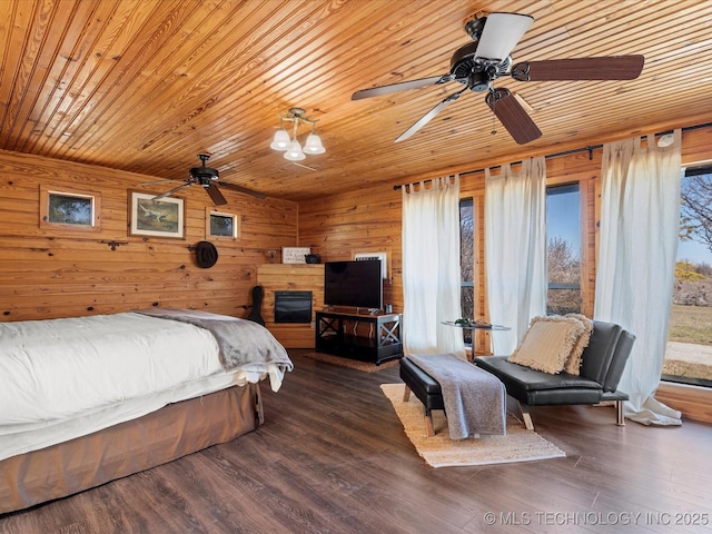 bedroom featuring vaulted ceiling, wood ceiling, wooden walls, and wood finished floors